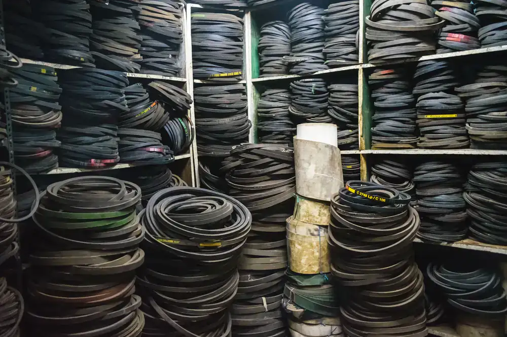 Neatly organized shelves of auto parts inside the Indus Auto Parts warehouse